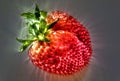 3D-Illustration Kirlian glow on strawberries with leaves on a plate in a glas bowl. Isolated on a white background