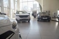 Kirov, Russia - April 12, 2022: Cars in showroom of dealership Kia in Kazan in country Russia. Partial focus