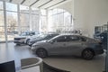 Kirov, Russia - April 12, 2022: Cars in showroom of dealership Kia in Kazan in country Russia. Partial focus