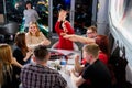 Kirov, Russia - April 18, 2019: People at tables in cafe or restaurant being glad something. Intellectual game indoors