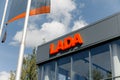 Kirov, Russia - August 2021: LADA logo on the exhibition hall building on a sunny day. The brand of cars produced by