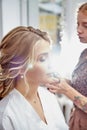 Kirov, Russia - August 28, 2020: Stylist or make up artist making makeup for beautiful bride on the wedding day Royalty Free Stock Photo