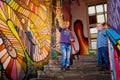 Kirov, Russia - August 11, 2019: Two boys on stairs in itresting museum named Fantazarium full of drawing and graffiti