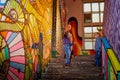 Kirov, Russia - August 11, 2019: Two boys on stairs in itresting museum named Fantazarium full of drawing and graffiti