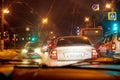 Kirov, Russia - December 30, 2017: Car in the night city. Colorful night traffic. Evening city with traffic lights