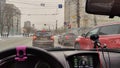 Kirov, Russia - February 14, 2023: Looking throught car window to the city street with houses