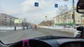 Kirov, Russia - February 14, 2023: Looking throught car window to the city street with pedestrians at the intersection