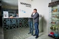 Kirov, Russia - February 25, 2019: Man waiting treatment in spa near reception and nobody near him