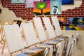 KIROV, RUSSIA - JUNE 23, 2017: Canvases standing in a row on the long table in the local art studio