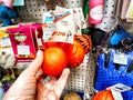 Kirov, Russia - September 08, 2023: Dog ball in hand among other things in the store. Persons hand selecting dog ball Royalty Free Stock Photo