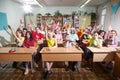 Kirov, Russia - September 28, 2019: Group of students or schoolchildren posing in classroom near their desks