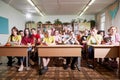 Kirov, Russia - September 28, 2019: Group of students or schoolchildren posing in classroom near their desks