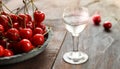 Kirsch or Kirschwasser in a glass and fresh cherry Royalty Free Stock Photo