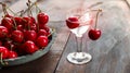 Kirsch or Kirschwasser in a glass and fresh cherry Royalty Free Stock Photo