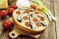 Kish with sprats and cherry tomatoes Royalty Free Stock Photo