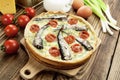 Kish with sprats and cherry tomatoes Royalty Free Stock Photo