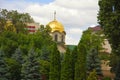 Kishinev. Moldova. 07.29.22. View of the golden dome of the church behind the green trees. Royalty Free Stock Photo