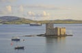 Kisimul castle and Caledonian MacBrayne Ferry on the bay at Castlebay, Barra.