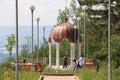 Tourists near gazebo with white columns and a copper dome Royalty Free Stock Photo