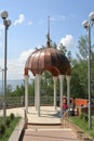 Tourists near gazebo with white columns and a copper dome Royalty Free Stock Photo