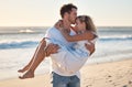 Kiss, beach and man carrying woman for romantic sunset embrace on Australia holiday in summer. Couple, love and happy Royalty Free Stock Photo