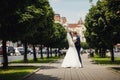 Kiss on city park alley. Blurred urban background Royalty Free Stock Photo
