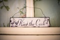 Closeup of a `Kiss the Cook` Sign Royalty Free Stock Photo
