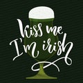 Kiss me, I`m irish - handwritten funny st. Patrick`s day saying with illustration of green beer glass. Royalty Free Stock Photo