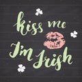 Kiss me, I`m irish. St Patrick`s Day greeting card Hand lettering with lips and clovers, Irish holiday brushed calligraphic sign v Royalty Free Stock Photo