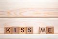 Kiss me made of wood background. Love concept. Kissing sign, emotions concept. Word today written with wooden cubes. St Royalty Free Stock Photo