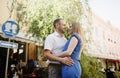 Happy couple in love hugging and kissing on the street old town. Royalty Free Stock Photo