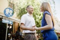 Happy couple in love hugging and kissing on the street old town. Royalty Free Stock Photo