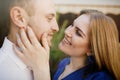 Happy couple in love hugging and kissing on the street old town. Royalty Free Stock Photo