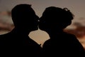 The kiss at sunset (silhouette) Royalty Free Stock Photo