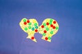 kiss of two colorful heads on a blue background, creative art design, sparkling look, love in the air