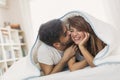 Kiss under the sheets Royalty Free Stock Photo