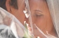 Kiss, woman and man at wedding with veil, love and commitment at outdoor reception. Romance, face of bride and groom at Royalty Free Stock Photo