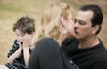 Kissing Adults and Horrified Boy Royalty Free Stock Photo
