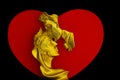 Kissing couple golden sculpture with red heart background