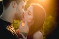 Kissing couple in love. Sexy lovers kiss outdoor at sunset. Sensual Young people.