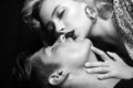 Kissing couple. Passion and sensual touch. Kissing posing indoor on dark background. Beautiful passionate couple Royalty Free Stock Photo