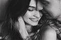 Kissing couple portrait. Young couple deeply in love sharing a romantic kiss, closeup profile view of their faces Royalty Free Stock Photo