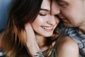 Kissing couple portrait. Young couple deeply in love sharing a romantic kiss, closeup profile view of their faces Royalty Free Stock Photo