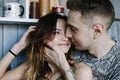 Kissing couple portrait. Young couple deeply in love sharing a romantic kiss, closeup profile view of their faces Royalty Free Stock Photo