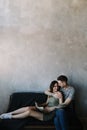 Kissing couple portrait. Young couple deeply in love sharing a romantic kiss, closeup profile view of their faces Royalty Free Stock Photo