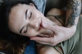 Kissing couple portrait. Young couple deeply in love sharing a romantic kiss, closeup  view of their faces Royalty Free Stock Photo