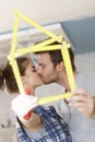 Kissing couple renewing home Royalty Free Stock Photo