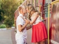 Kissing couple on the trailway station .