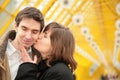 Kissing couple on yellow bridge Royalty Free Stock Photo
