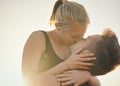 Kissing is a great calorie burner. a young couple kissing outdoors.